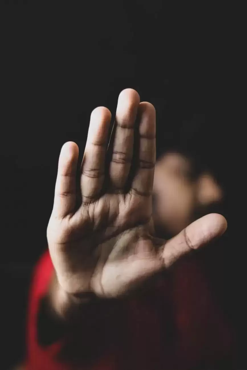 Young boy with hand prominent in picture