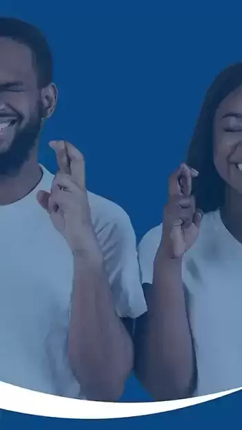 Two parents with fingers crossed